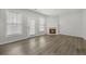 Bright living room with fireplace, stylish flooring, and a glass door to the backyard at 4878 Hairston Park Sq, Stone Mountain, GA 30083