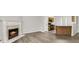 Inviting living space with fireplace, bar seating, and a view to the kitchen at 4878 Hairston Park Sq, Stone Mountain, GA 30083