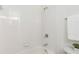 Bright bathroom featuring a white tiled shower and tub combination at 201 16Th Nw St # 4, Atlanta, GA 30363