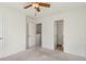 Bright bedroom featuring a ceiling fan and an ensuite bathroom at 201 16Th Nw St # 4, Atlanta, GA 30363