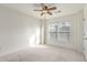 Bright bedroom featuring a ceiling fan and a large window at 201 16Th Nw St # 4, Atlanta, GA 30363