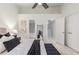 A bedroom featuring neutral decor, a ceiling fan, and an ensuite bathroom at 201 16Th Nw St # 4, Atlanta, GA 30363