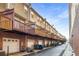 Townhome exteriors showing brick facade, garages, and private balconies at 201 16Th Nw St # 4, Atlanta, GA 30363