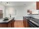 Elegant kitchen area with black countertops, stainless steel appliances, and refined decor at 201 16Th Nw St # 4, Atlanta, GA 30363