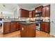 Charming kitchen features wooden cabinets, stainless steel appliances, and a functional center island at 201 16Th Nw St # 4, Atlanta, GA 30363