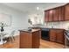 Bright kitchen with a center island, modern appliances, and adjacent eating area at 201 16Th Nw St # 4, Atlanta, GA 30363