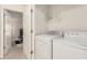 Bright laundry room featuring a washer, dryer, and a doorway at 201 16Th Nw St # 4, Atlanta, GA 30363