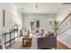 Stylish living room featuring hardwood floors, a gray sofa, and plenty of natural light at 201 16Th Nw St # 4, Atlanta, GA 30363