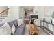 Inviting living room features a fireplace, hardwood floors, and comfortable furnishings at 201 16Th Nw St # 4, Atlanta, GA 30363