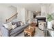 Comfortable living room with hardwood floors, fireplace, and staircase at 201 16Th Nw St # 4, Atlanta, GA 30363