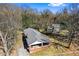 Aerial view of home nestled among mature trees, showing roof and proximity to neighboring houses at 2163 Ben Hill Rd, Atlanta, GA 30344