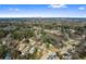 Expansive aerial view of homes surrounded by dense greenery, with city skyline in distance at 2163 Ben Hill Rd, Atlanta, GA 30344