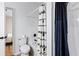 Bathroom with a toilet, shower with curtain, and updated black fixtures at 2163 Ben Hill Rd, Atlanta, GA 30344