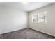 Bright, empty bedroom with neutral carpet, white walls, and lots of natural light at 2163 Ben Hill Rd, Atlanta, GA 30344