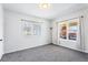 Bright bedroom with neutral carpet, plenty of natural light and white walls at 2163 Ben Hill Rd, Atlanta, GA 30344