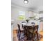 Cozy dining area with a table set for four, located near the bright kitchen with natural light at 2163 Ben Hill Rd, Atlanta, GA 30344