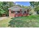 Charming brick home with a cozy front porch and well-maintained lawn at 2163 Ben Hill Road Rd, Atlanta, GA 30344