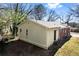 A charming home featuring durable siding, a brick chimney, and secure back entrance for peace of mind at 2163 Ben Hill Rd, Atlanta, GA 30344