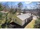 Rear exterior view of a well-maintained home, enhanced by natural light and a mix of durable siding and brick at 2163 Ben Hill Rd, Atlanta, GA 30344