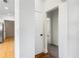 Bright hallway with white walls, hardwood floors, and doorways leading to other rooms at 2163 Ben Hill Rd, Atlanta, GA 30344