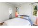 Bedroom featuring wood-look flooring, neutral walls, and en suite bathroom at 2163 Ben Hill Rd, Atlanta, GA 30344