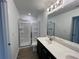 Bathroom with a double sink vanity and a walk in shower at 2105 Stillhaven Pl, Douglasville, GA 30135