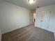 Neutral bedroom featuring plush carpeting, closet, and a sunlit window at 2105 Stillhaven Pl, Douglasville, GA 30135