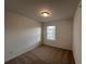 Bedroom featuring neutral carpeting, a single window, and neutral walls at 2105 Stillhaven Pl, Douglasville, GA 30135