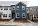 Charming townhome with a blue exterior, complemented by a well-maintained front yard at 2105 Stillhaven Pl, Douglasville, GA 30135