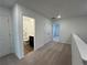 Upstairs hallway with bathroom access, carpet flooring, and neutral paint at 2105 Stillhaven Pl, Douglasville, GA 30135