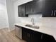 Well-equipped kitchen with stainless steel dishwasher, undermount sink and white subway tile backsplash at 2105 Stillhaven Pl, Douglasville, GA 30135