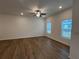 Spacious living room featuring hardwood floors and ample natural light from large windows at 2105 Stillhaven Pl, Douglasville, GA 30135
