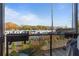 Balcony view showcasing the neighborhood scenery with trees and buildings under a blue sky at 560 Dutch Valley Rd # 2313, Atlanta, GA 30324