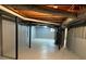 Unfinished basement with exposed ceiling and piping, painted concrete walls at 184 Wana Se Cir, Mableton, GA 30126