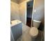 Bathroom featuring a modern vanity and sink with marble-style tiled walls at 184 Wana Se Cir, Mableton, GA 30126