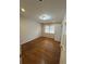 Bedroom featuring hardwood floors and a window providing natural light at 184 Wana Se Cir, Mableton, GA 30126