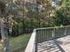 Relax on this expansive wooden deck surrounded by mature trees and a tranquil wooded area at 184 Wana Se Cir, Mableton, GA 30126