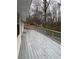 View of a spacious gray wood deck, perfect for outdoor entertaining and enjoying the natural surroundings at 184 Wana Se Cir, Mableton, GA 30126