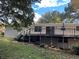 Back exterior of a home with a deck, white brick, and sliding glass doors at 184 Wana Se Cir, Mableton, GA 30126