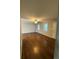Open living area with hardwood floors, ceiling fan, and ample natural light at 184 Wana Se Cir, Mableton, GA 30126