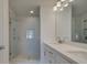 Modern bathroom features a double sink vanity, sleek countertops, and a glass-enclosed shower, offering a spa-like experience at 3316 Cranston Ln, Kennesaw, GA 30144