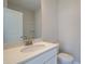 Bathroom featuring a white vanity with marble countertop and chrome faucet fixtures, providing a modern, clean aesthetic at 3316 Cranston Ln, Kennesaw, GA 30144