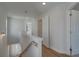 Upstairs hallway features ample natural light, neutral walls, and a linen closet, creating a functional and airy space at 3316 Cranston Ln, Kennesaw, GA 30144
