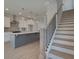 Modern kitchen features a large island with a sink and stainless steel appliances at 3316 Cranston Ln, Kennesaw, GA 30144