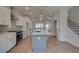 Bright open kitchen showcases an island, stainless steel appliances, and white cabinetry at 3316 Cranston Ln, Kennesaw, GA 30144