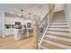 Elegant staircase showcasing wood treads, black iron spindles, and white risers, adding a touch of sophistication to the home at 3316 Cranston Ln, Kennesaw, GA 30144