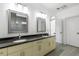 Bathroom features dual sinks, stylish vanity lighting, and a separate water closet at 482 Pearl Cove Ct, Atlanta, GA 30350