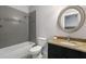 This bathroom features gray tile, granite countertops, and a shower-tub combination at 482 Pearl Cove Ct, Atlanta, GA 30350