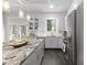 Bright kitchen featuring stainless steel appliances, granite countertops, and a window with natural light at 482 Pearl Cove Ct, Atlanta, GA 30350