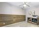 Cozy office with natural wood accent wall and a ceiling fan at 482 Pearl Cove Ct, Atlanta, GA 30350